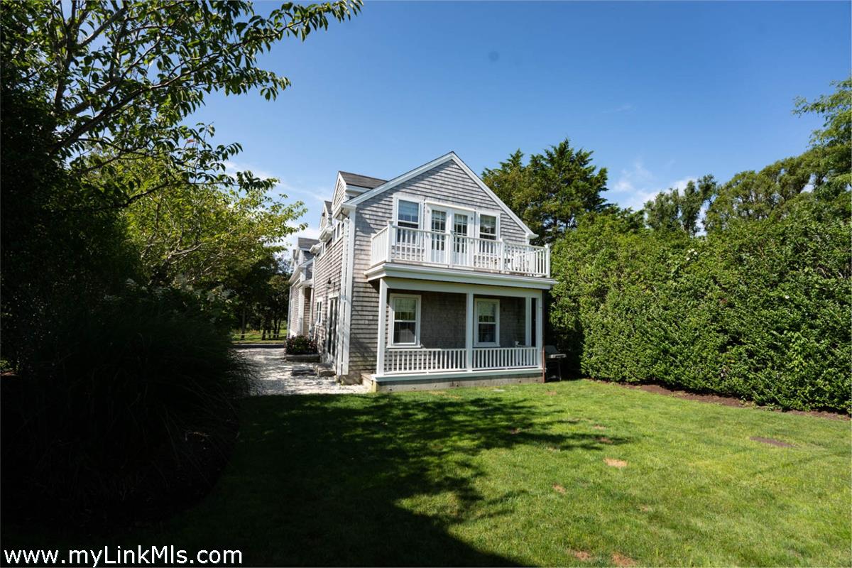 41 B Cliff Road Nantucket, MA 02554 - Photo 8 of 34 a front view of a house with garden