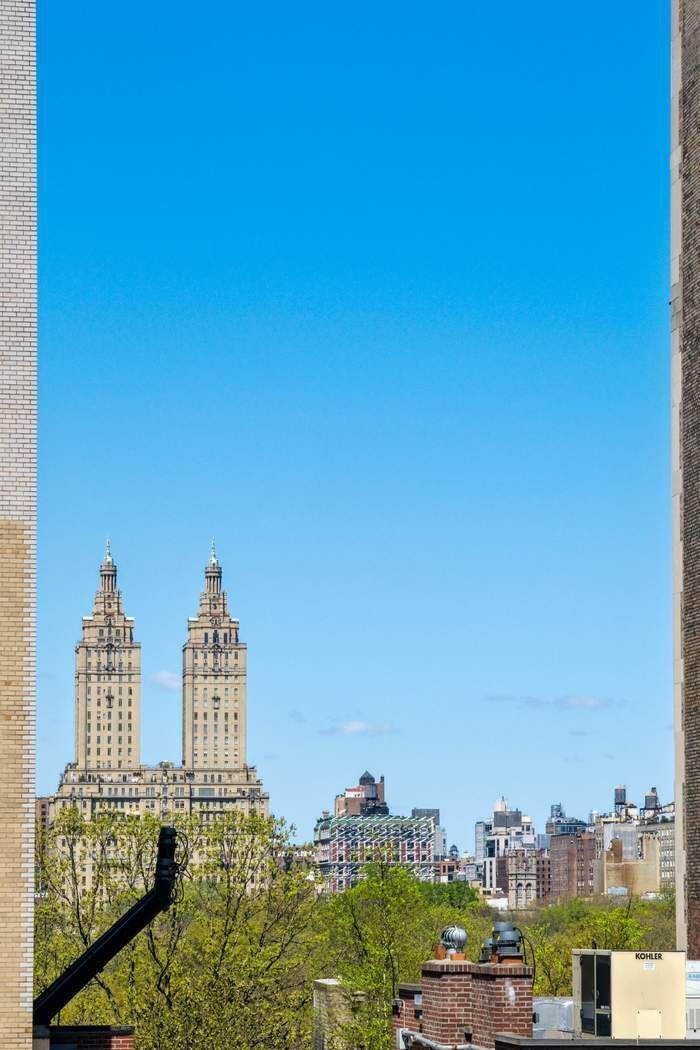 11 East 73rd Street, Unit PH Manhattan, NY 10021 - Photo 13 of 18 a view of a city with tall buildings in the background
