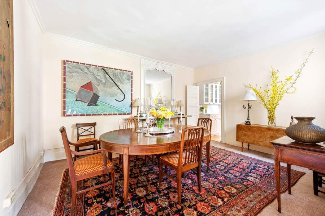 11 East 73rd Street, Unit PH Manhattan, NY 10021 - Photo 14 of 18 a dining room with furniture a rug and a painting