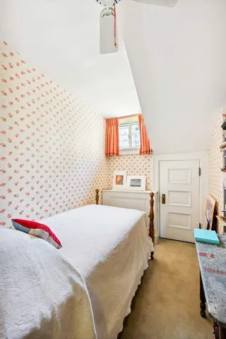 a kitchen with a refrigerator and a stove top oven