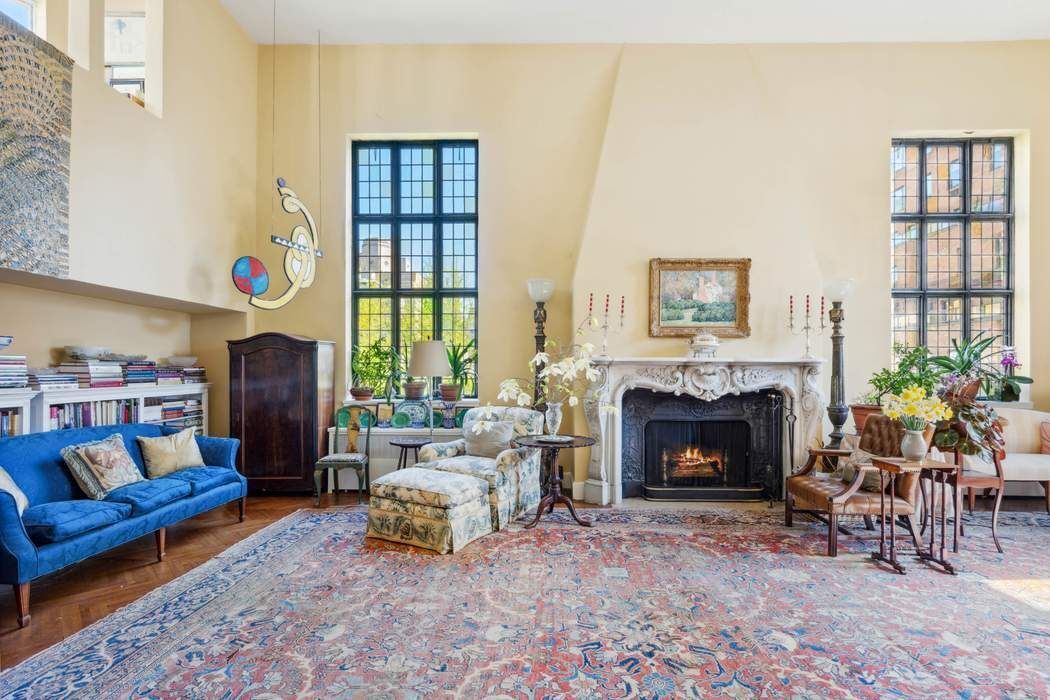 11 East 73rd Street, Unit PH Manhattan, NY 10021 - Photo 4 of 18 a living room with furniture and a fireplace