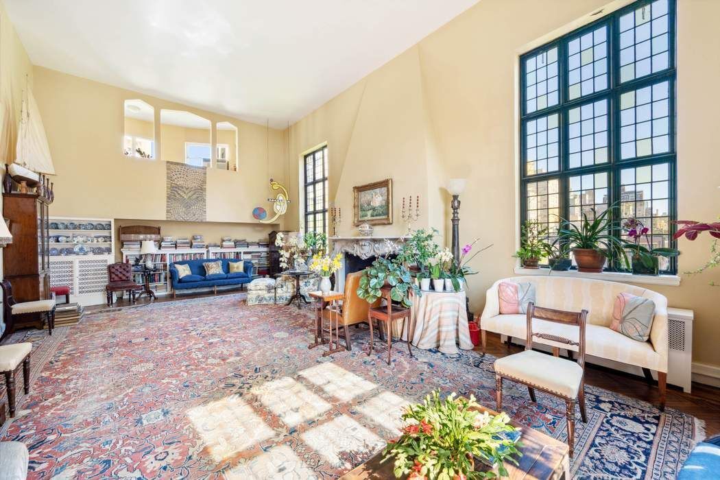 11 East 73rd Street, Unit PH Manhattan, NY 10021 - Photo 6 of 18 a living room filled with furniture and a large window