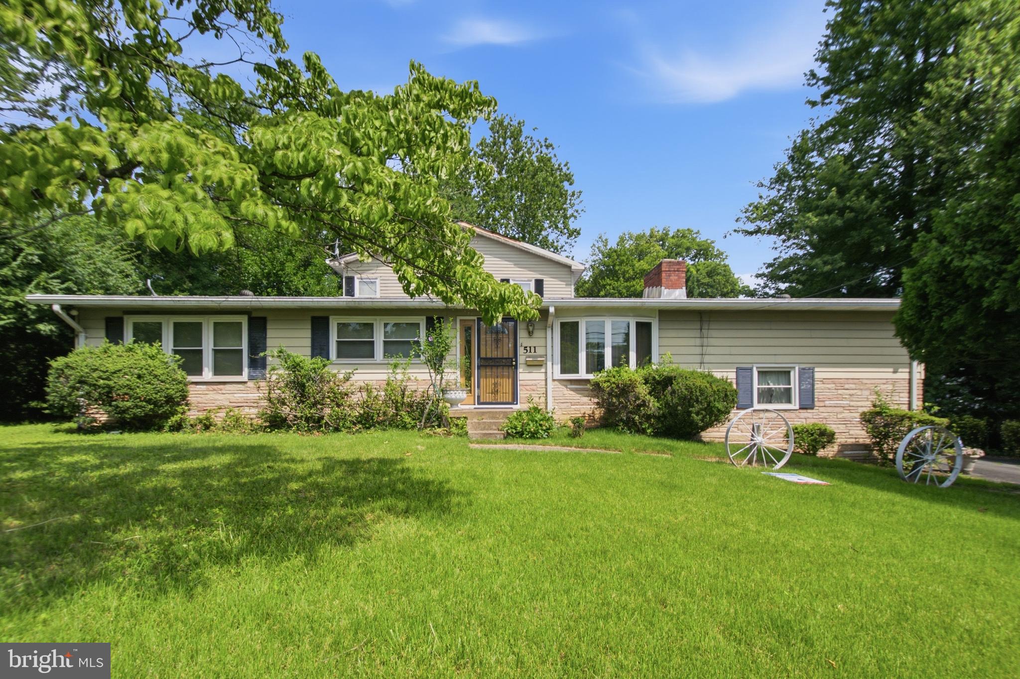 511 Malcolm Road Northwest Vienna, VA 22180 - Photo 4 of 16 a front view of house with yard and green space