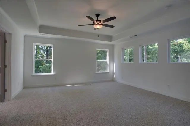 a bathroom with a granite countertop sink a toilet and a mirror