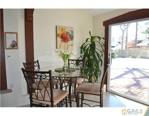 9 Dorian Road Metuchen, NJ 08840 - Photo 11 of 25 a view of a dining room with furniture and a potted plant