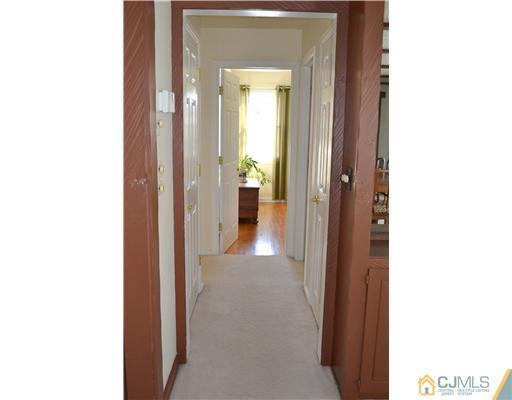 9 Dorian Road Metuchen, NJ 08840 - Photo 13 of 25 a view of a hallway with wooden floor