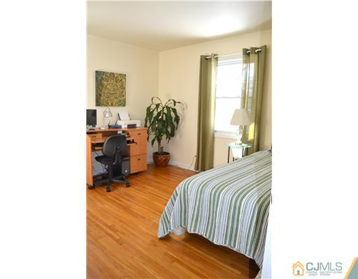 9 Dorian Road Metuchen, NJ 08840 - Photo 15 of 25 a bedroom with a bed and a window