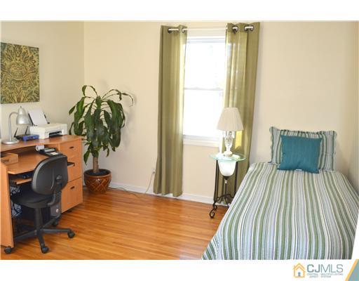 9 Dorian Road Metuchen, NJ 08840 - Photo 16 of 25 a bedroom with a bed and a window