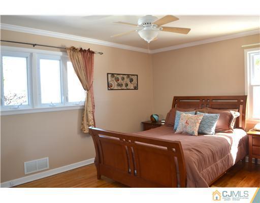 9 Dorian Road Metuchen, NJ 08840 - Photo 20 of 25 a bedroom with a bed and a window