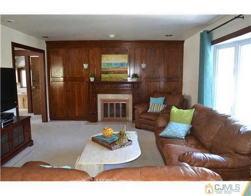 9 Dorian Road Metuchen, NJ 08840 - Photo 3 of 25 a living room with furniture and a flat screen tv