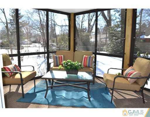 9 Dorian Road Metuchen, NJ 08840 - Photo 24 of 25 a living room with a table and chairs