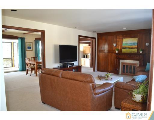 9 Dorian Road Metuchen, NJ 08840 - Photo 5 of 25 a living room with furniture and a flat screen tv
