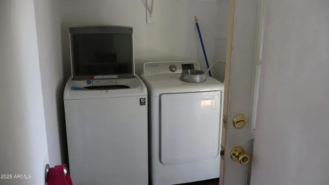a utility room with dryer and washer
