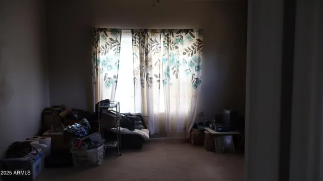 a room with furniture and a large window