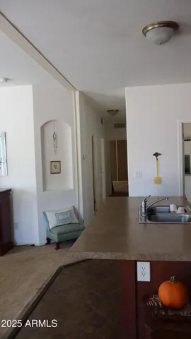 a bedroom with a bed and lamp