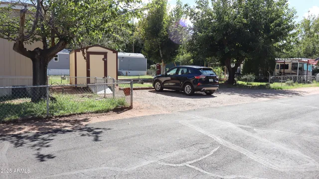 a view of a car park in front of a house