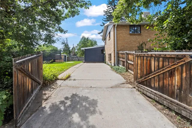 a view of a entrance gate of a house with wooden floor
