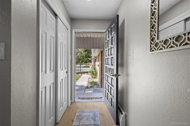 a view of a hallway with a outdoor space