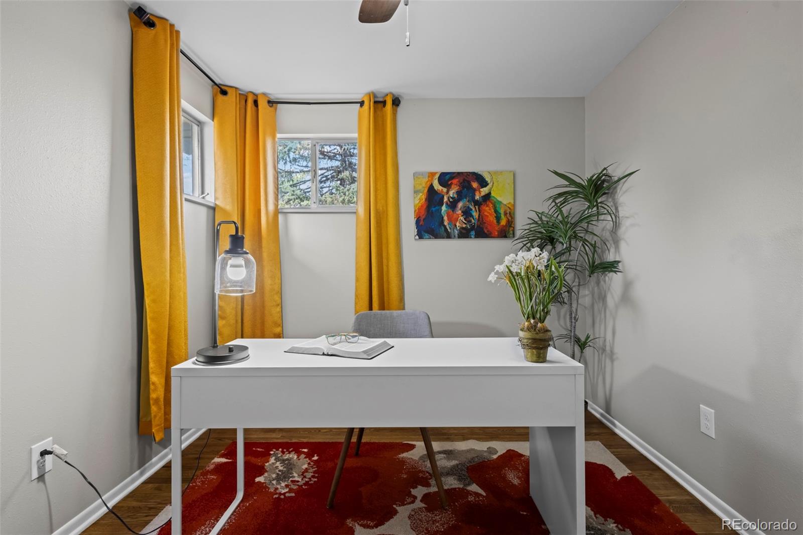 390 Scranton Street Aurora, CO 80011 - Photo 30 of 45 a bathroom with a sink and a mirror
