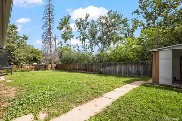 a backyard of a house with lots of green space