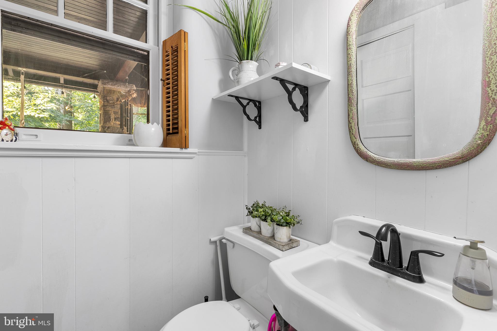238 Fox Road Media, PA 19063 - Photo 18 of 74 a bathroom with a toilet sink and mirror