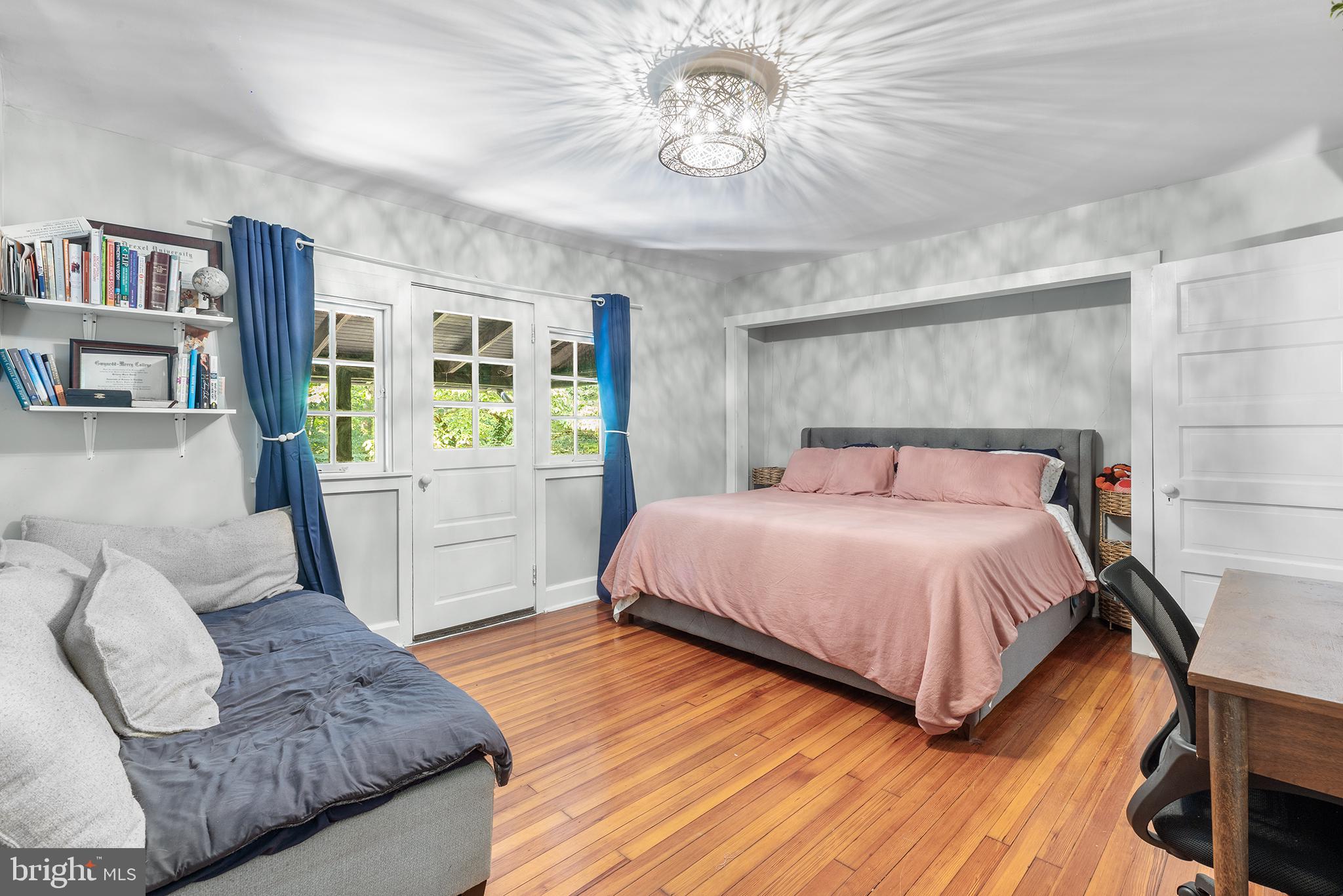 238 Fox Road Media, PA 19063 - Photo 19 of 74 a bedroom with a large bed and a chandelier