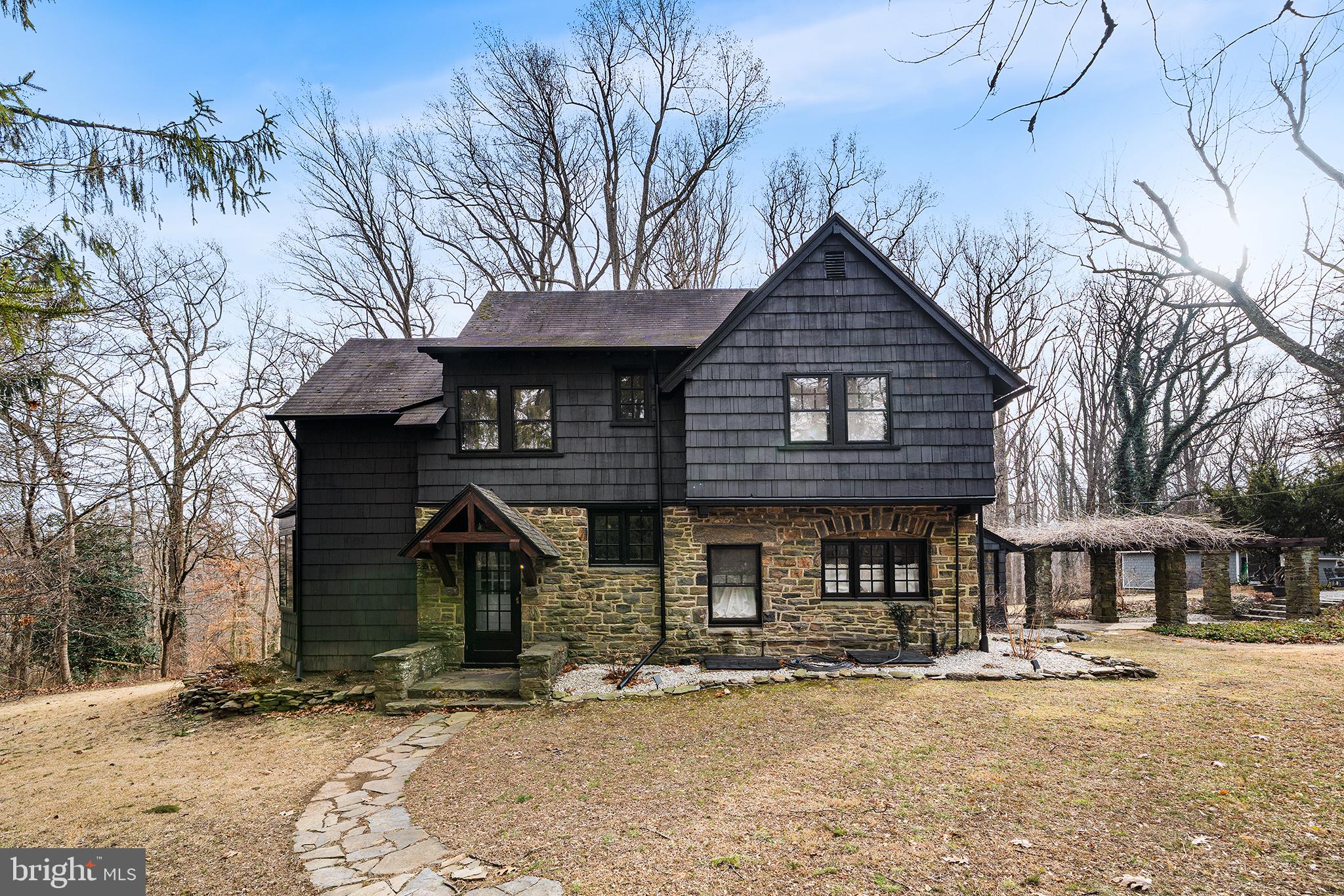 238 Fox Road Media, PA 19063 - Photo 3 of 74 a front view of a house with garden