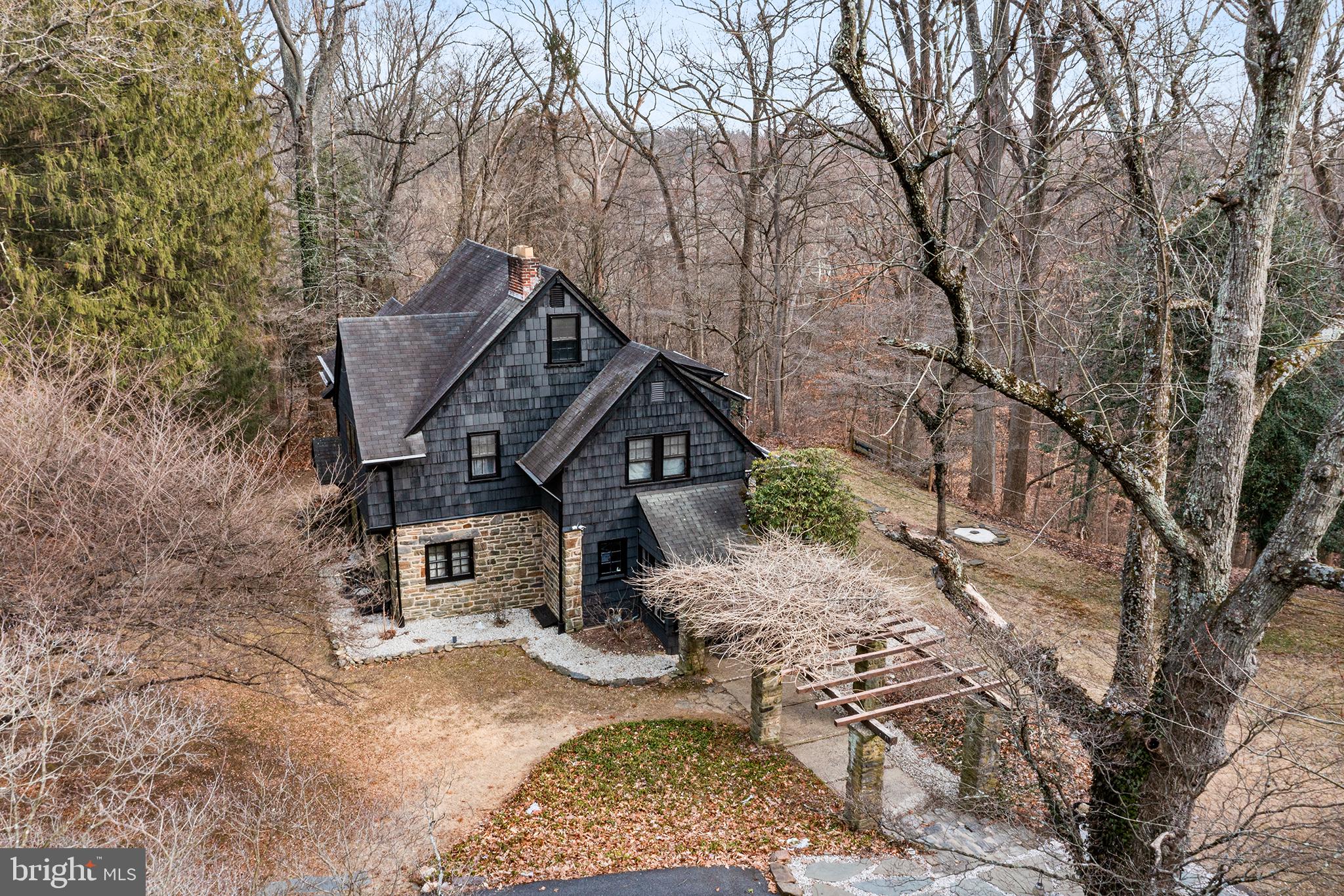238 Fox Road Media, PA 19063 - Photo 56 of 74 a front view of a house with a yard covered in snow