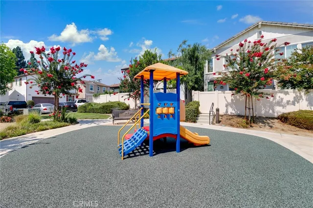 a childrens park with lots of swings and slides