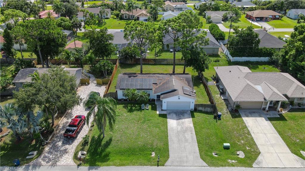 18347 Fuchsia Road Fort Myers, FL 33967 - Photo 1 of 35 an aerial view of a house with a yard