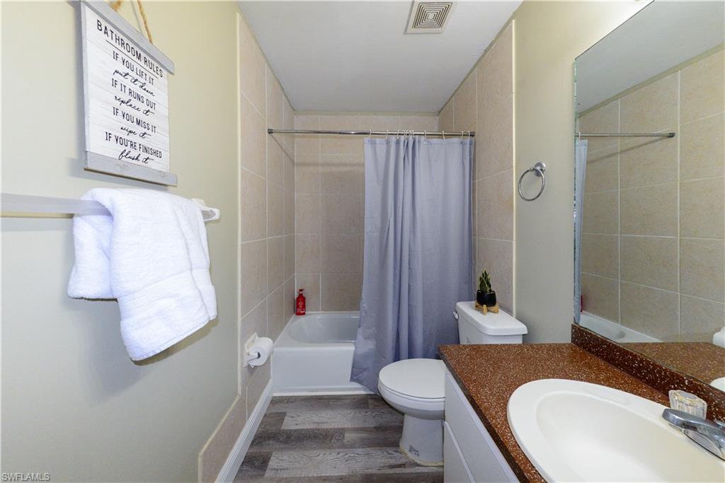 18347 Fuchsia Road Fort Myers, FL 33967 - Photo 21 of 35 a bathroom with a sink toilet and shower