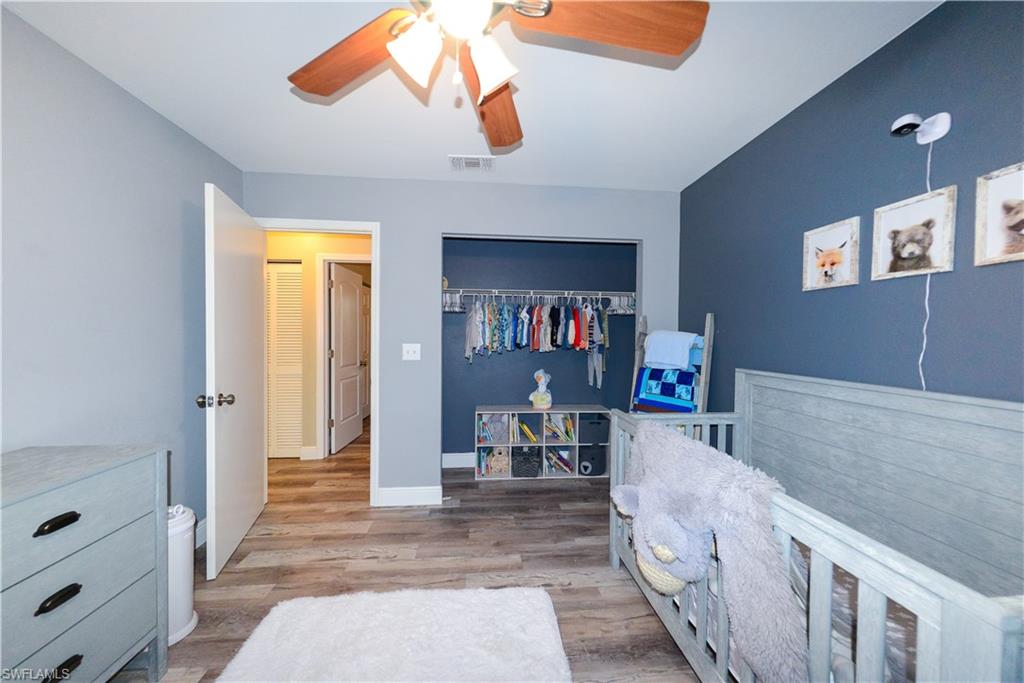 18347 Fuchsia Road Fort Myers, FL 33967 - Photo 23 of 35 a living room with furniture and a wooden floor