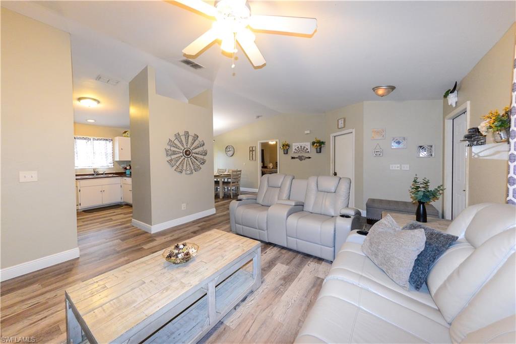 18347 Fuchsia Road Fort Myers, FL 33967 - Photo 26 of 35 a living room with furniture and a wooden floor