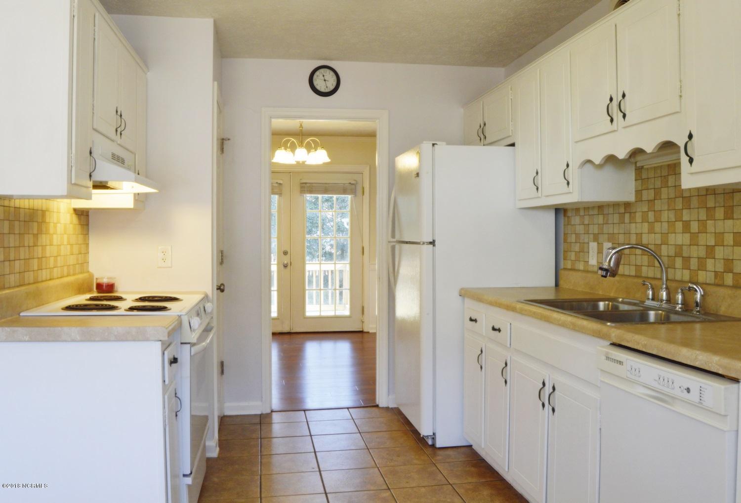 313 North Hampton Road Wilmington, NC 28409 - Photo 9 of 22 Tiled kitchen with breakfast area, pantry AND bay window