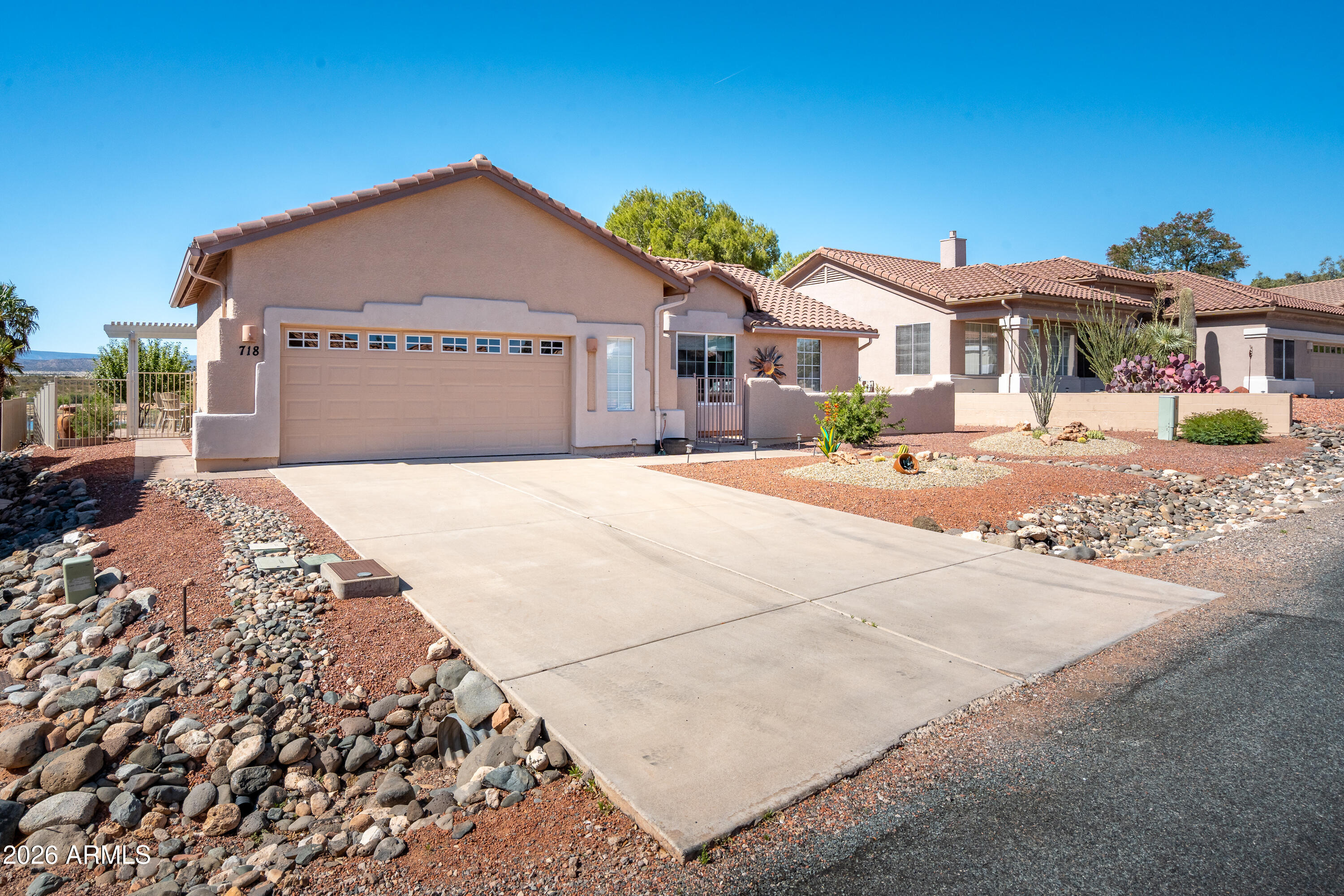 718 South Wandering River Road Cornville, AZ 86325 - Photo 3 of 41 a front view of a house with a yard