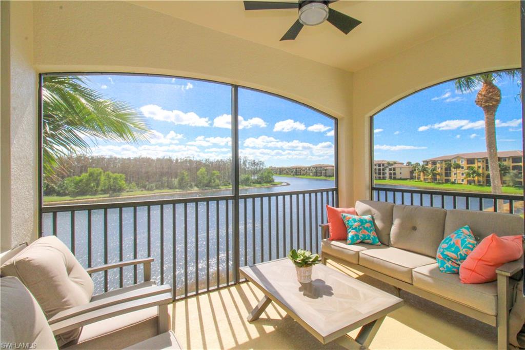 9554 Trevi Court, Unit 4737 Naples, FL 34113 - Photo 1 of 49 a balcony with furniture and a floor to ceiling window