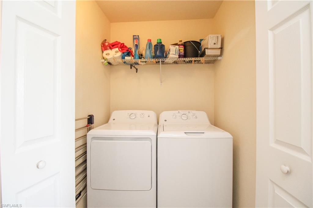 9554 Trevi Court, Unit 4737 Naples, FL 34113 - Photo 13 of 49 a utility room with dryer and washer