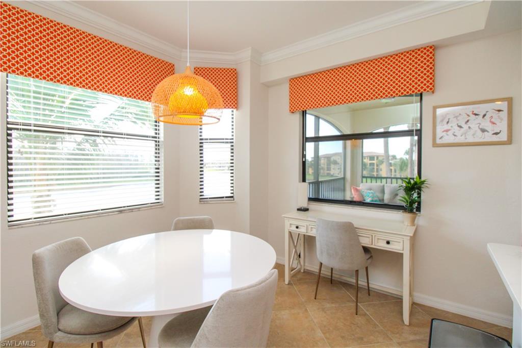 9554 Trevi Court, Unit 4737 Naples, FL 34113 - Photo 30 of 49 a view of a dining room with furniture and window
