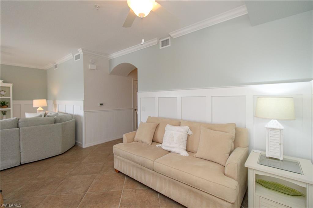 9554 Trevi Court, Unit 4737 Naples, FL 34113 - Photo 35 of 49 a living room with furniture and a couch