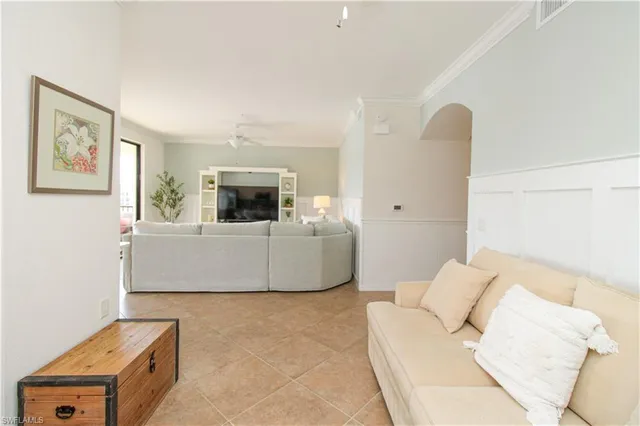 a balcony with furniture and garden view