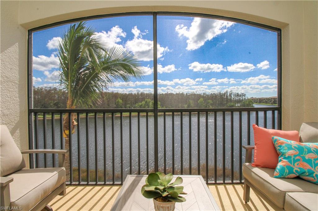 9554 Trevi Court, Unit 4737 Naples, FL 34113 - Photo 37 of 49 a balcony with furniture and garden view