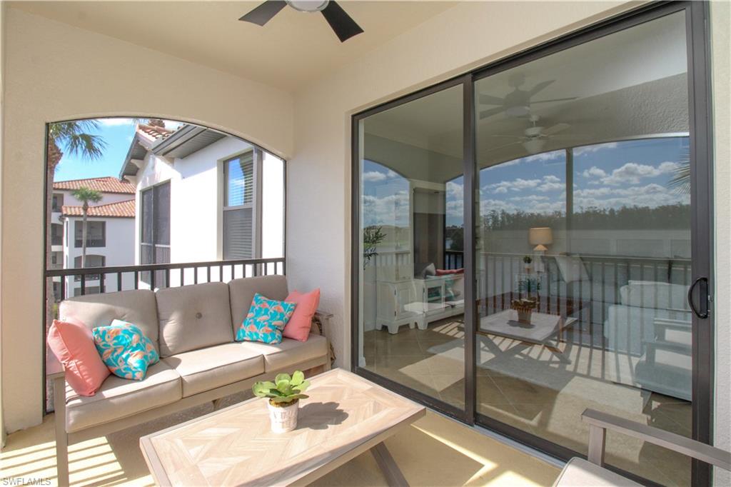 9554 Trevi Court, Unit 4737 Naples, FL 34113 - Photo 40 of 49 a living room with a glass door