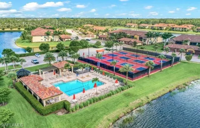 a view of a swimming pool with a yard