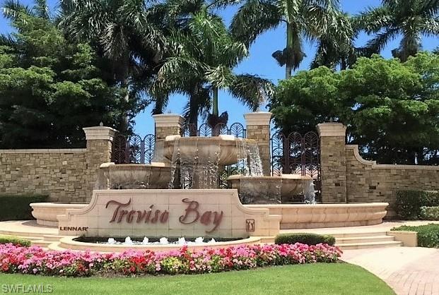 9554 Trevi Court, Unit 4737 Naples, FL 34113 - Photo 48 of 49 a view of a house with a yard