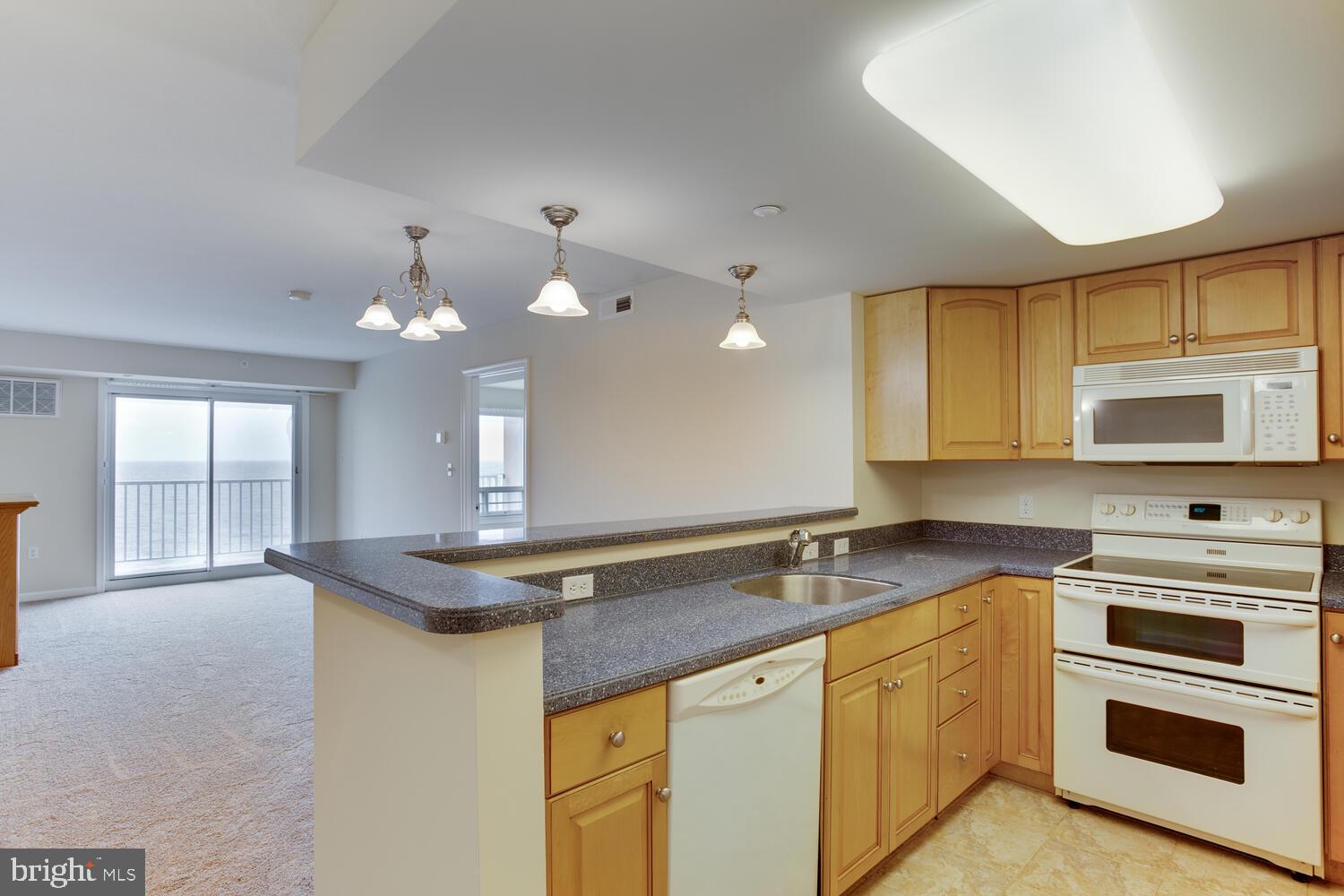 8501 Bayside Road, Unit 408 Chesapeake Beach, MD 20732 - Photo 9 of 34 Kitchen with Corian countertops.