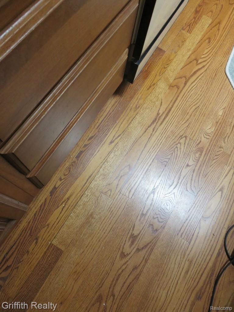 20563 Wasson Road Pinckney, MI 48169 - Photo 20 of 44 Beautiful oak floors, match the solid oak custom doors and trim throughout the house.