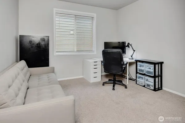 a workspace with furniture and a window