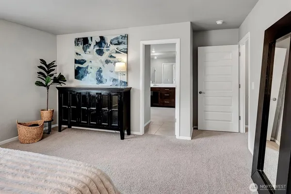 a bed room with a bed and a television