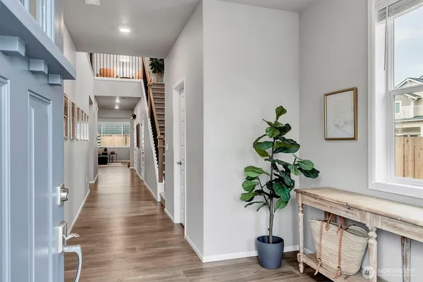 a view of entryway with wooden floor