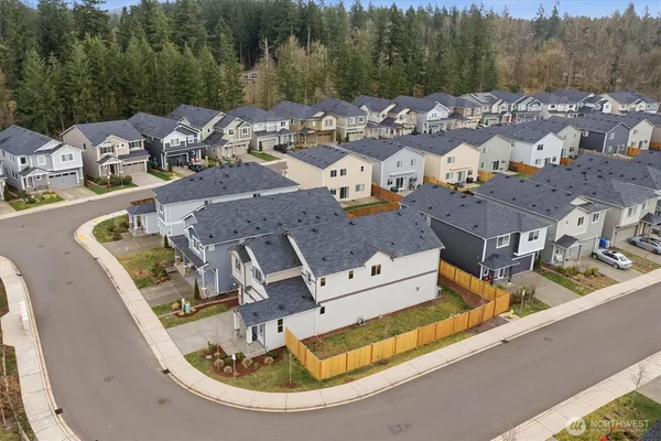 a view of houses with an outdoor space and lakeside